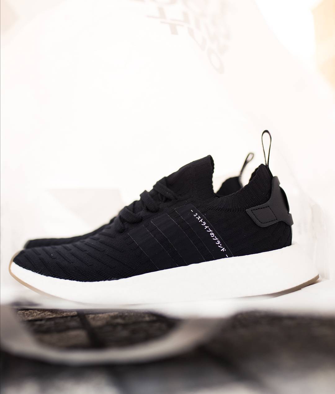 Adidas NMD_R2 Primeknit
Black / White